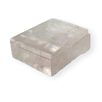 Side angle view of a light pink optical calcite icelandic spar crystal