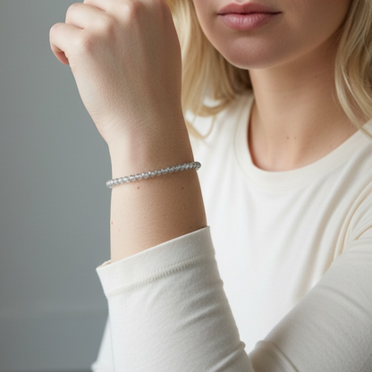 An AI model wearing the bracelet to show size.