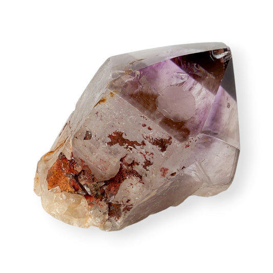 Amethyst crystal on a white background