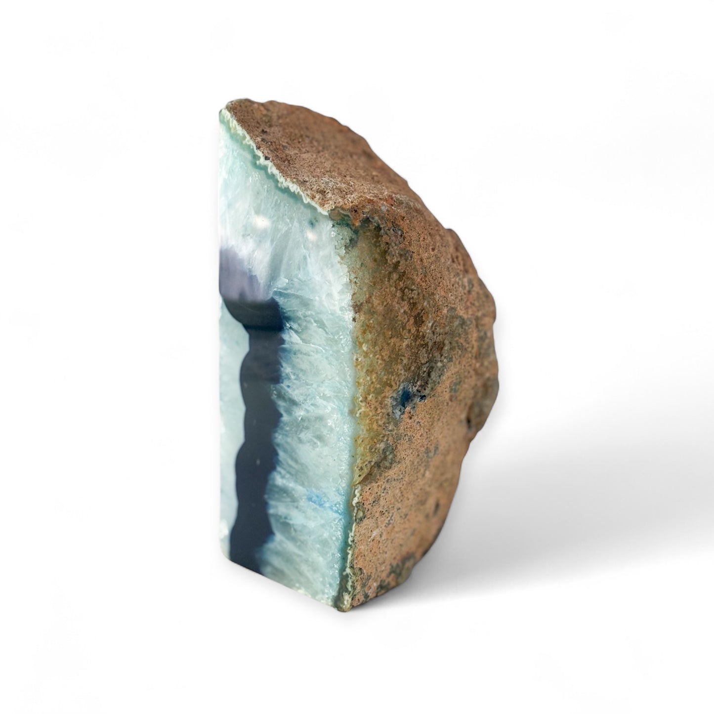 Raw back of single blue agate bookend with natural surface