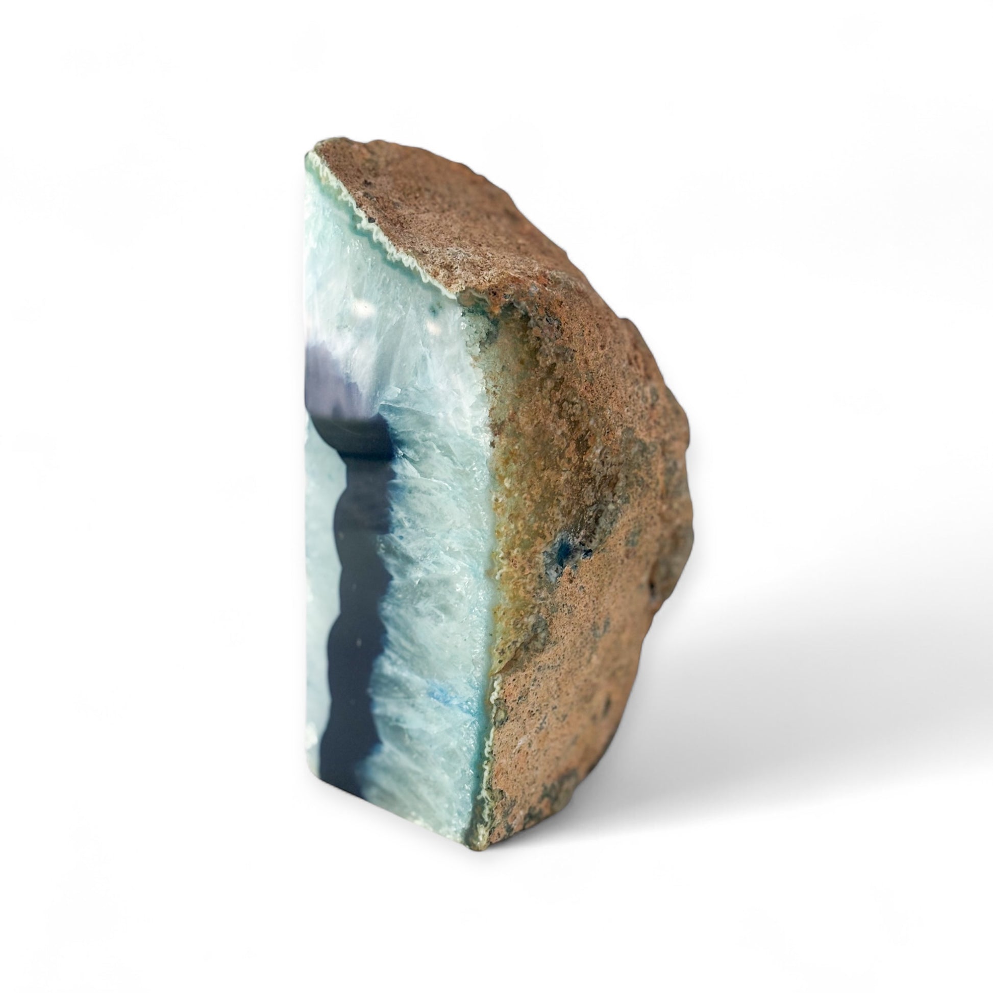 Raw back of single blue agate bookend with natural surface