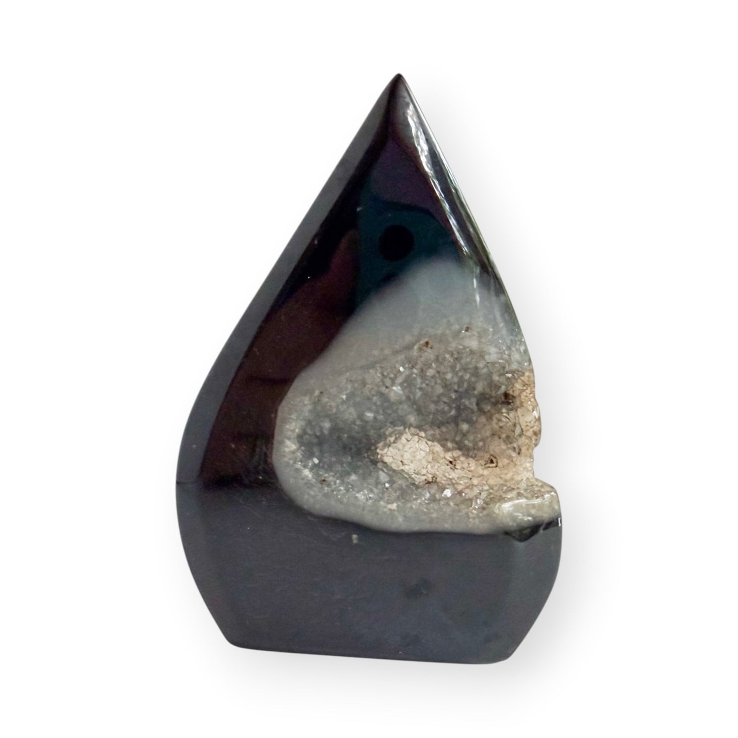 Black agate, free standing teardrop with drusy accent on white background.