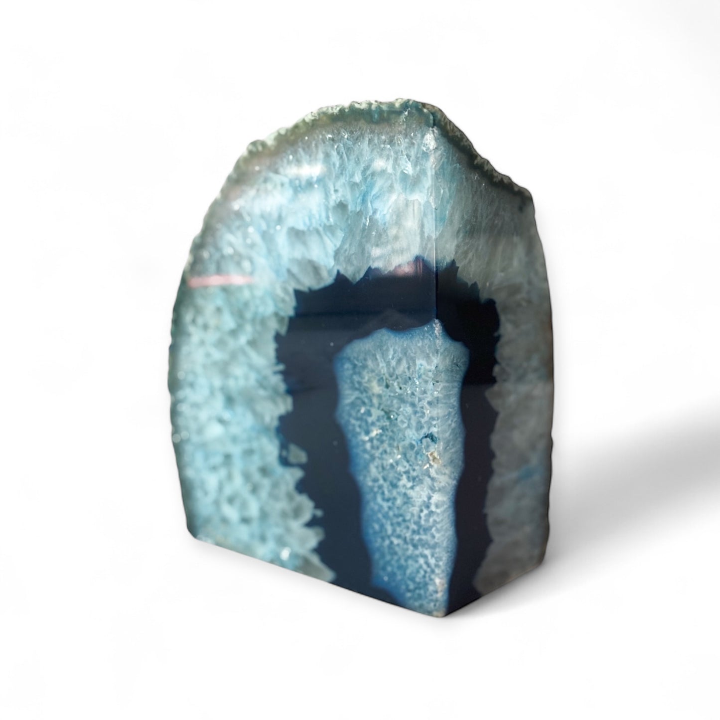 Left-side blue agate bookend showing polished front and crystal center