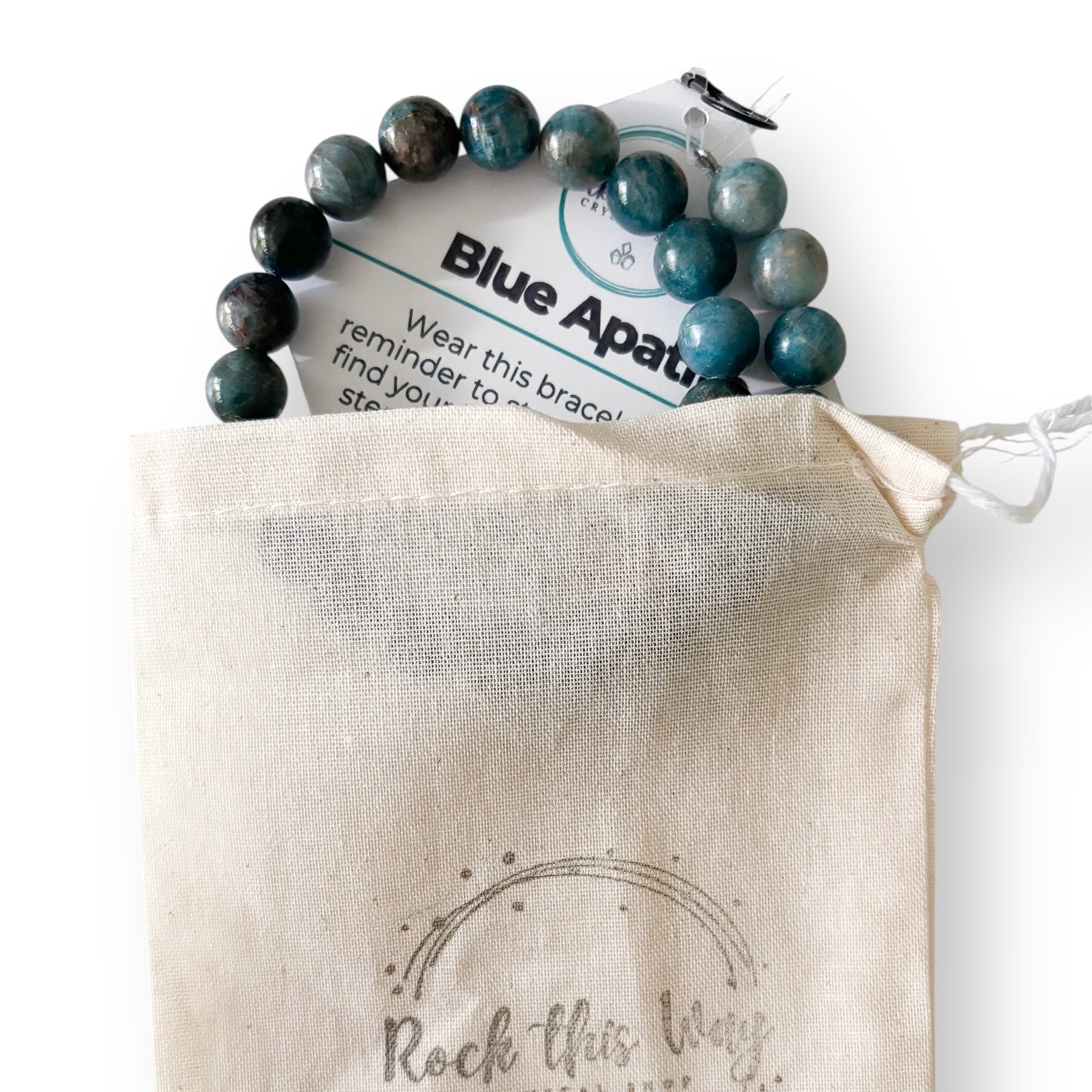 Blue apatite bracelet on a branded card over a 'Rock this Way' pouch