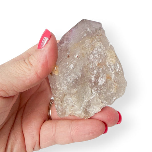 Bottom of Purple Amethyst Crystal in hand showing detail.