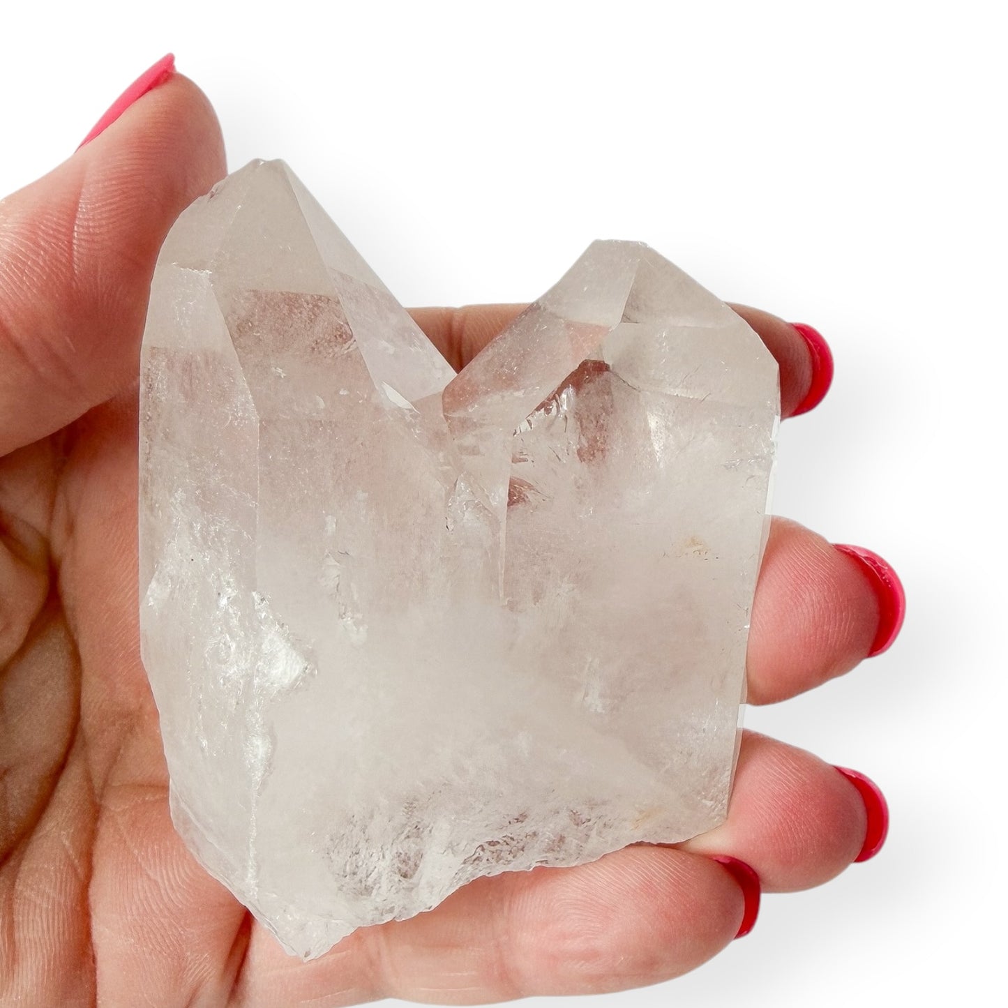 Clear quartz deep v twin points in hand  for reference and size