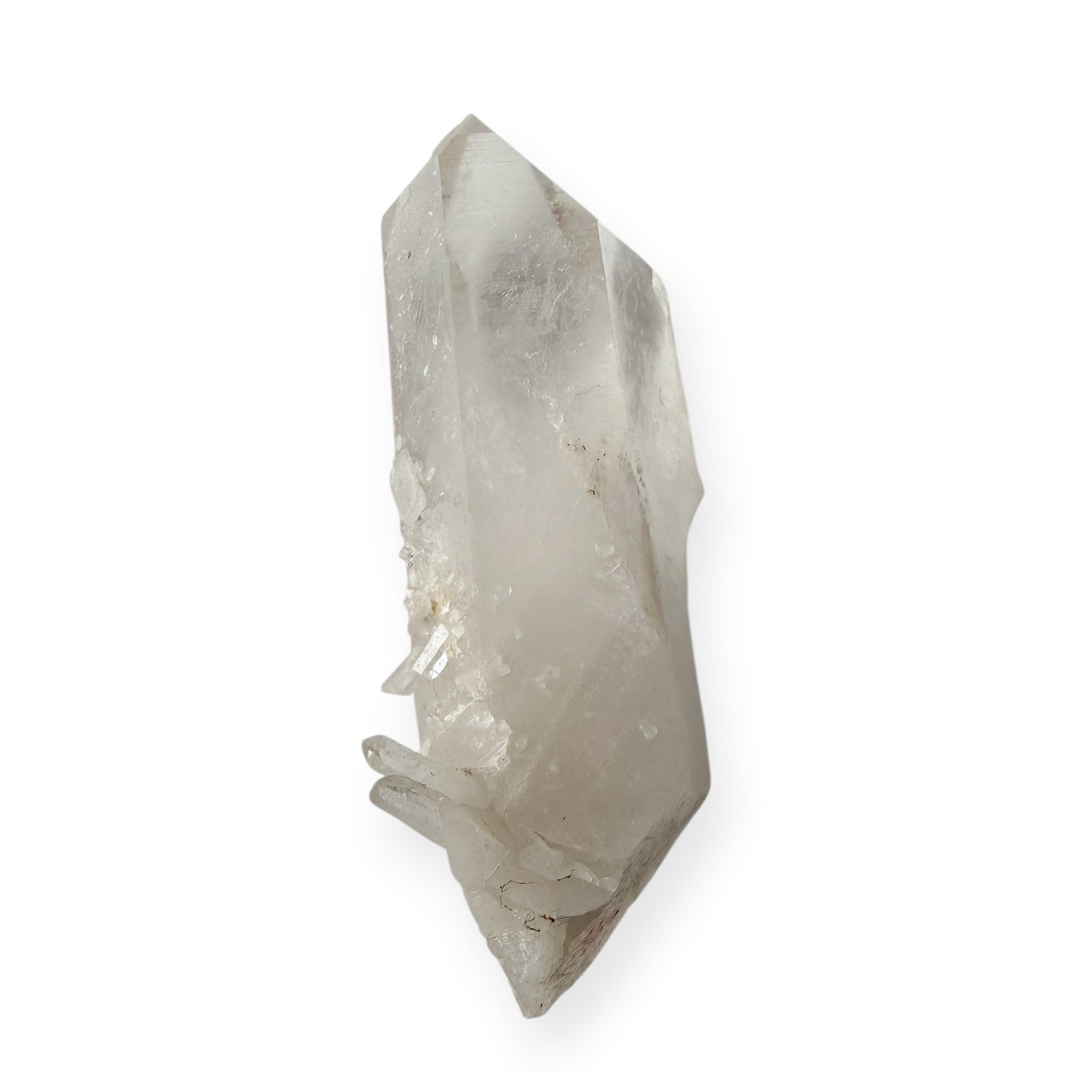 Clear quartz point translucent at the top, opaque at the base, with a spray of needle quartz towards the base. 