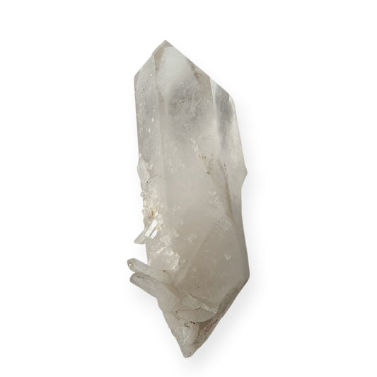 Clear quartz point translucent at the top, opaque at the base, with a spray of needle quartz towards the base. 