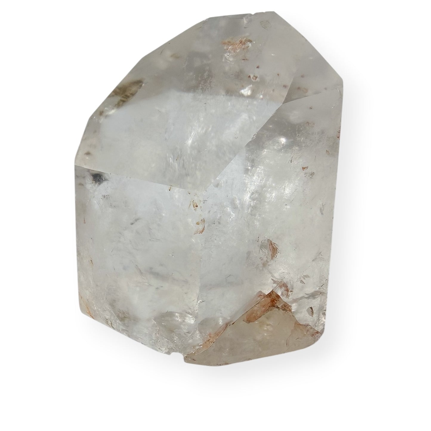 Clear quartz tower with white background showing imperfections.