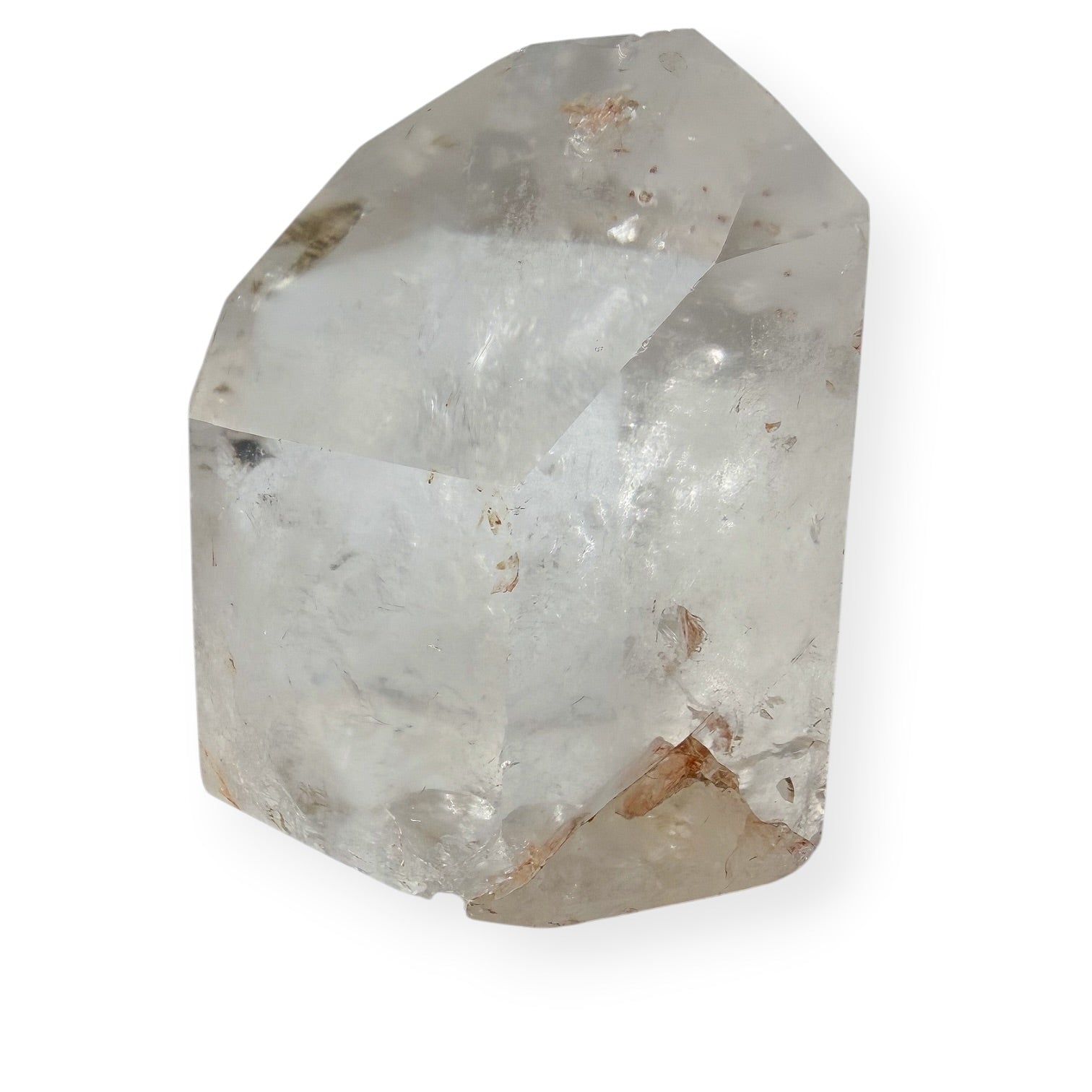 Clear quartz tower with white background showing imperfections.