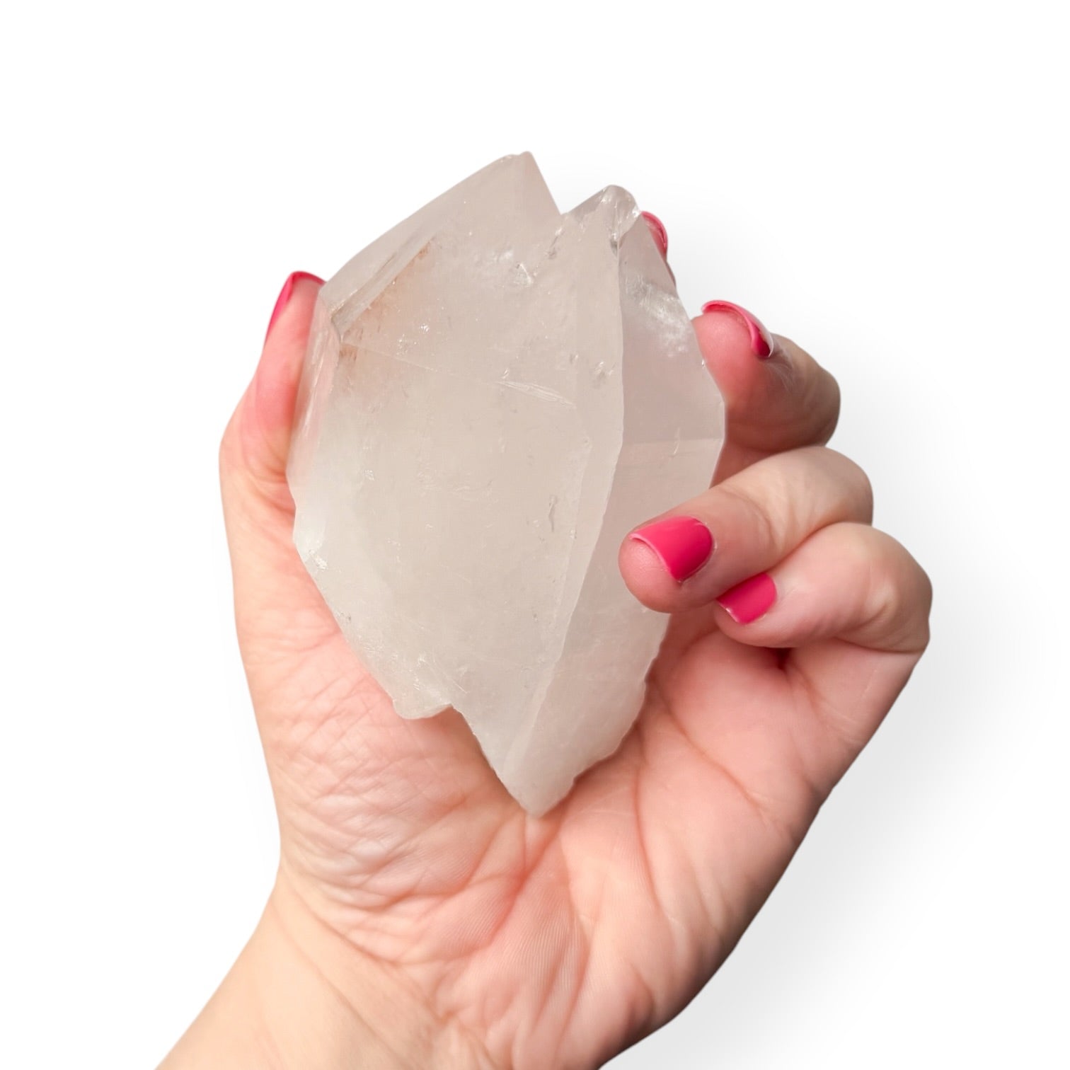 Clear quartz twin points in hand to show size and details. 