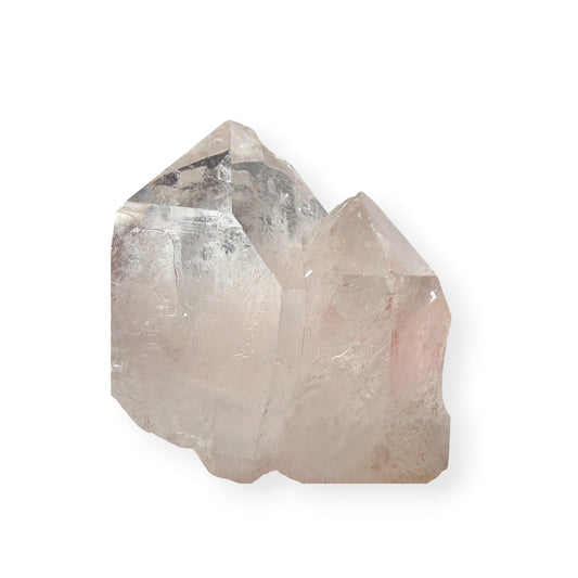 Clear Quartz Twin points on a white background.