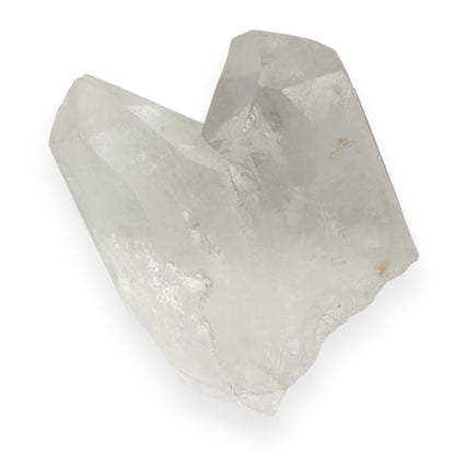 Distinct clear quartz points with a deep v on a white background