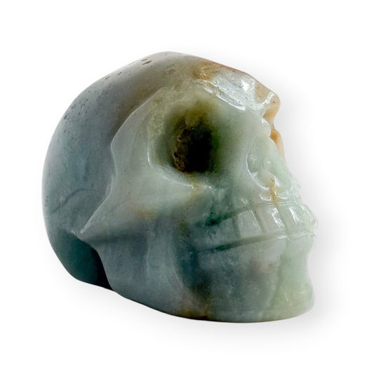 Hand carved Caribbean calcite skull on a white background.