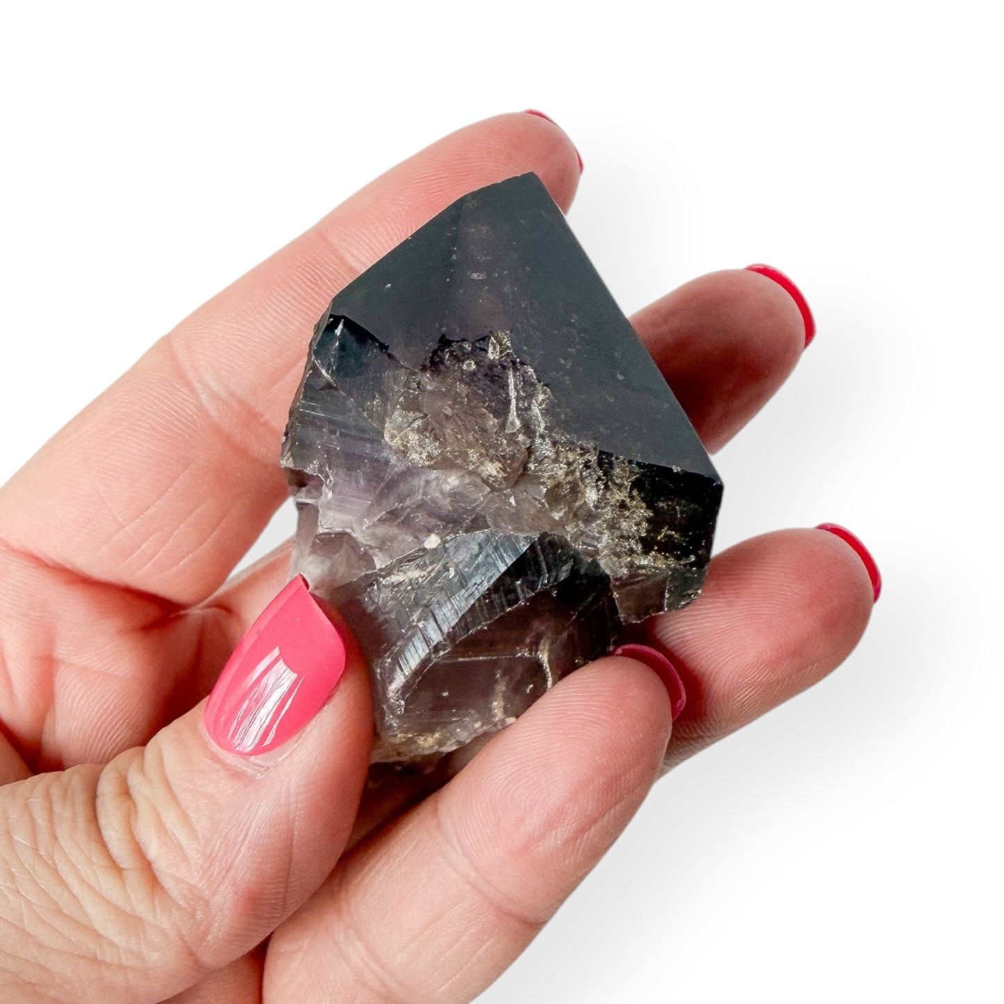 Purple Chevron Amethyst Point in hand showing details and size