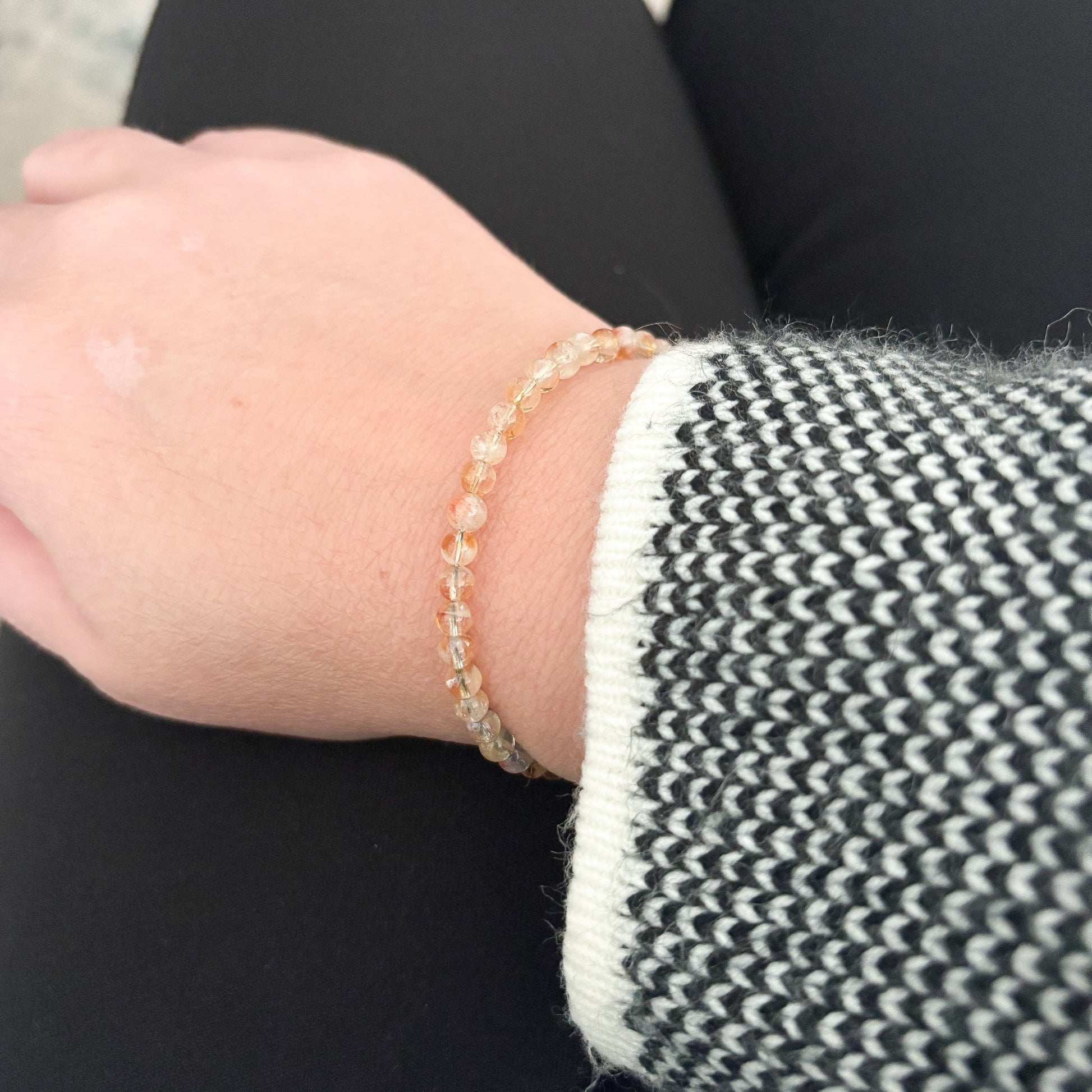 Natural crystals citrine flexible wrap bracelet on wrist.