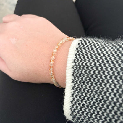 Natural crystals citrine flexible wrap bracelet on wrist.
