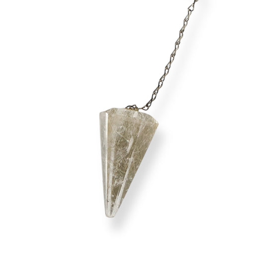 Close-up of golden rutile strands in clear quartz pendulum crystal with white background and stainless steel chain.