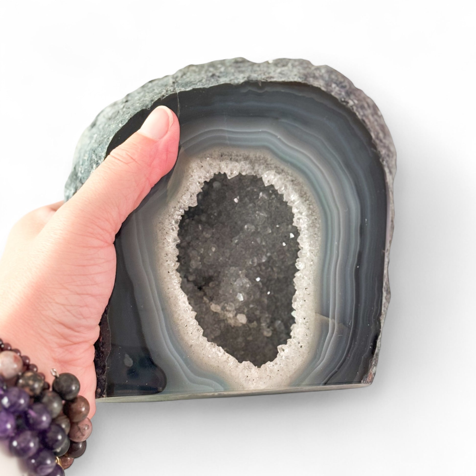 Size comparison with palm or hand holding the crystal