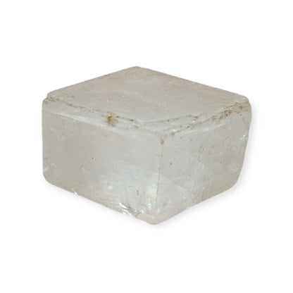 Rectangular clear calcite crystal with natural cracks and shine
