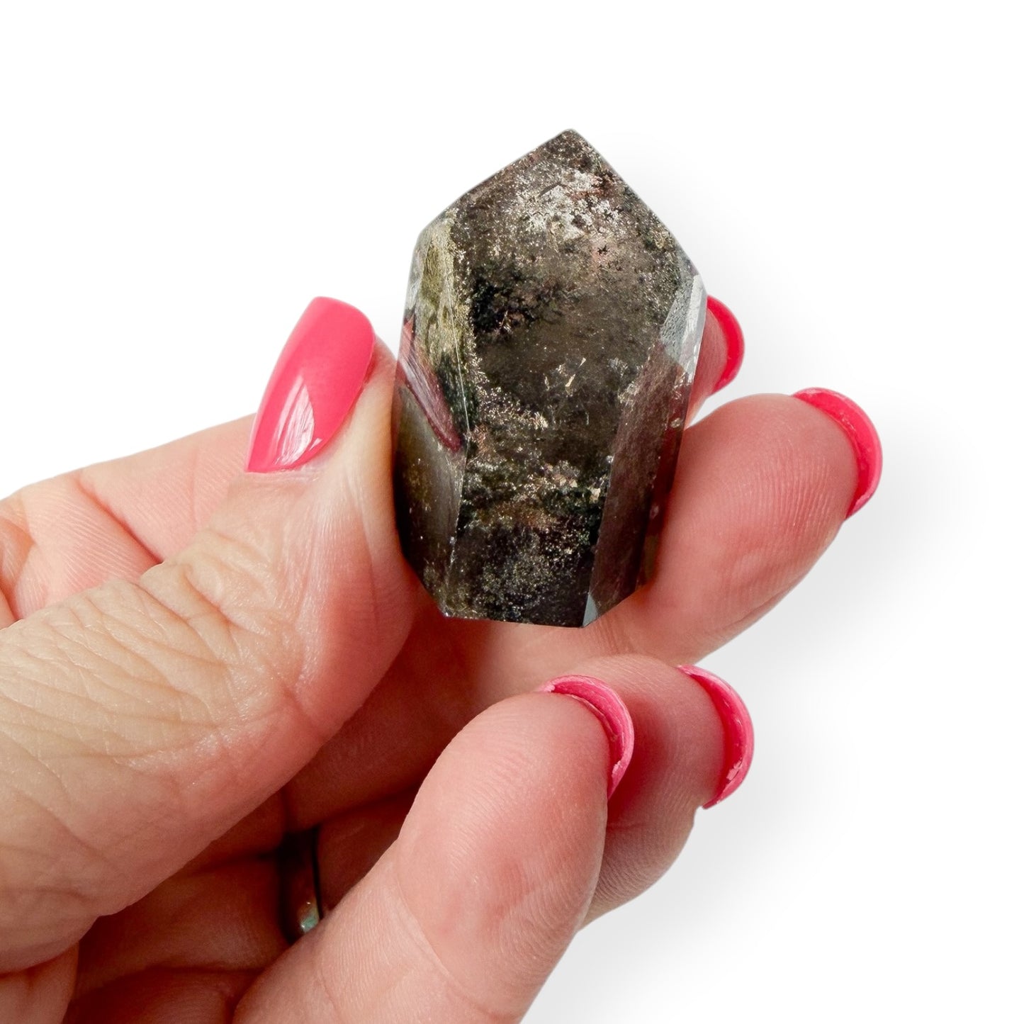 Lodolite garden quartz in hand to show details and size
