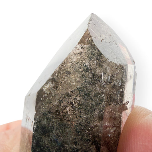 Lodolite quartz close up of the point with small scratches/chips. 