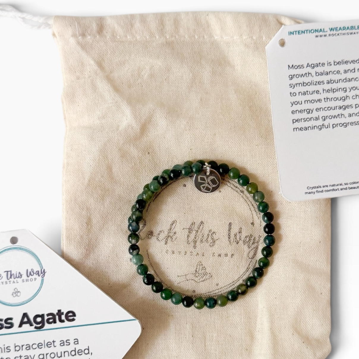 Moss agate bracelet with packaging and a Muslin bag.