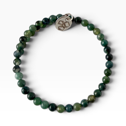 Moss agate wrap bracelet and a white background with 4 mm gemstone beads.