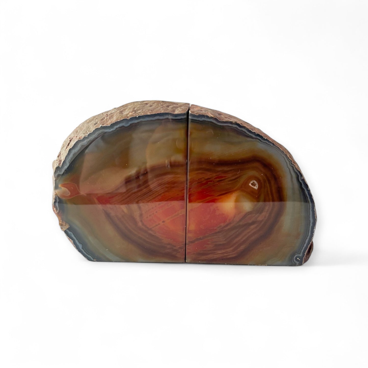 Natural agate bookends with red and brown banding, polished front and raw edges
