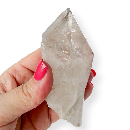 Clear quartz point in hand to show details. 