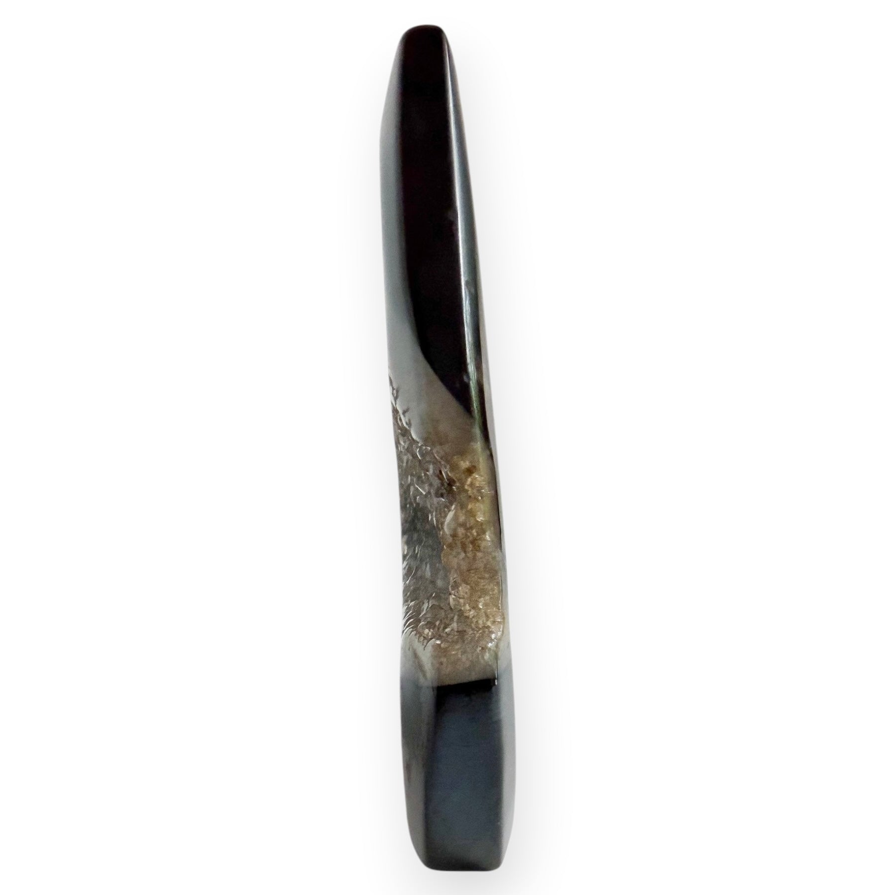 Side view of a black agate, teardrop freestanding freeform showing drusy detail on a white background.