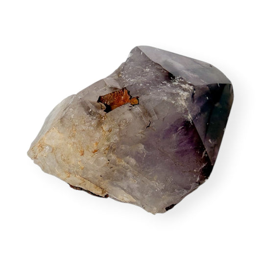 Small Purple Amethyst crystal on a white background