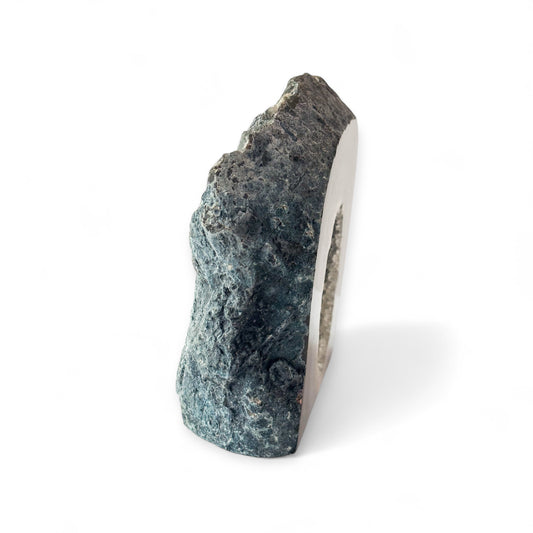 Crystal showing natural banding and raw stone edge