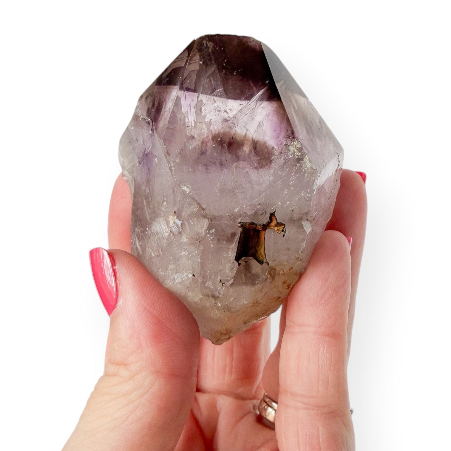 Small Amethyst point in hand to show size and detail.