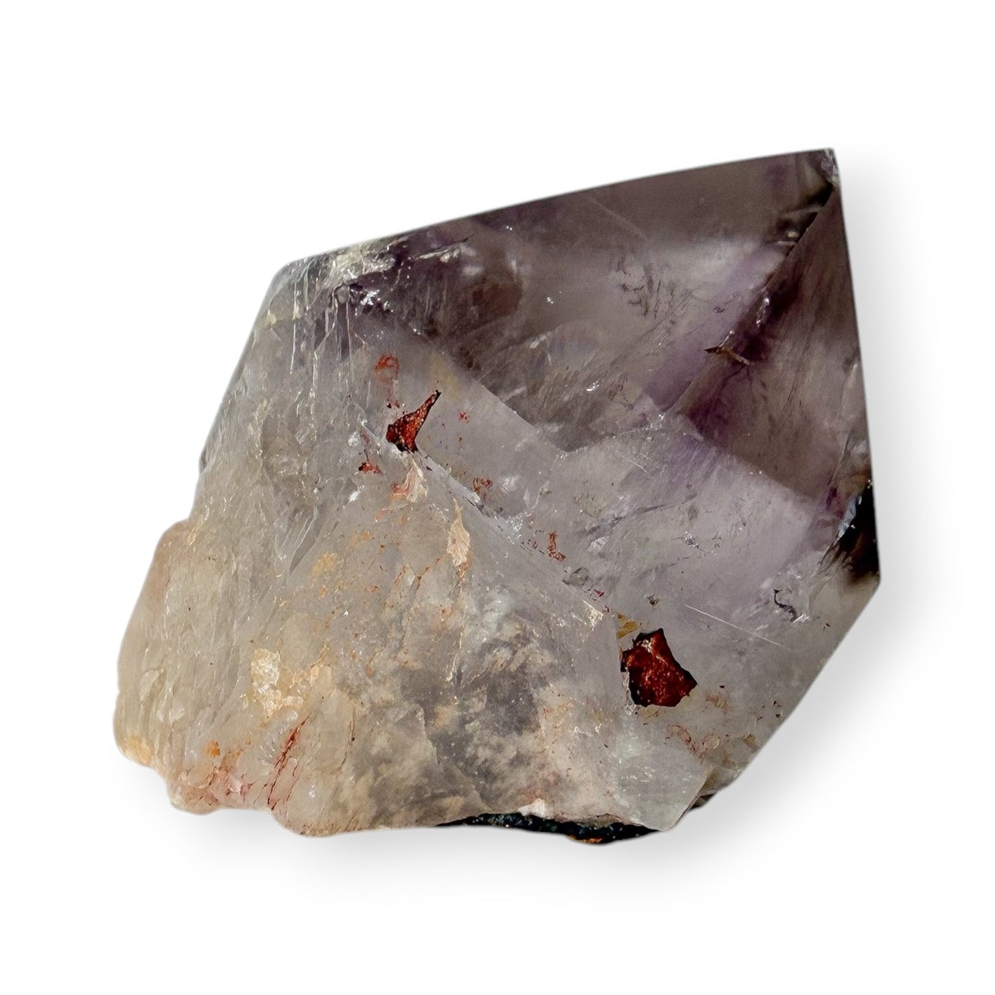Amethyst Crystal rock with a rough surface on a white background