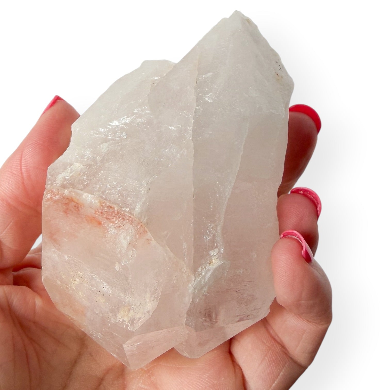 Twin point clear quartz in hand showing details.
