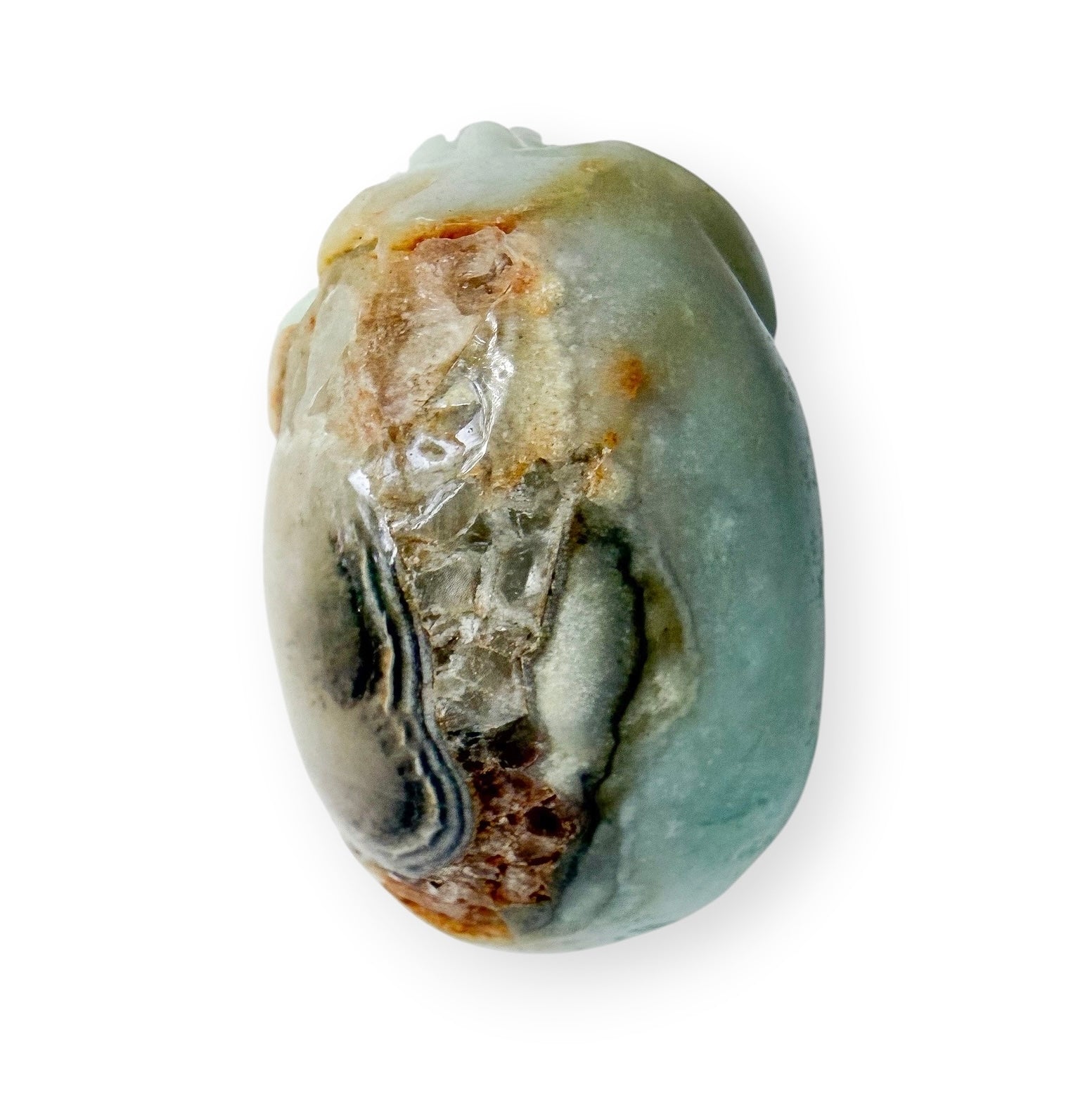 Top view of Caribbean calcite hand carved skull on a white background.
