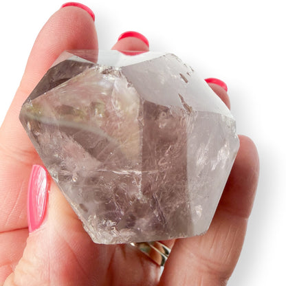 Top Small Amethyst showing Chip on the point.