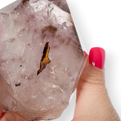 Up close detail of Amethyst Point in hand 