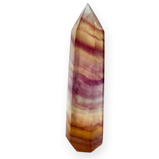 Yellow and purple striped fluorite, obelisk, and a white background