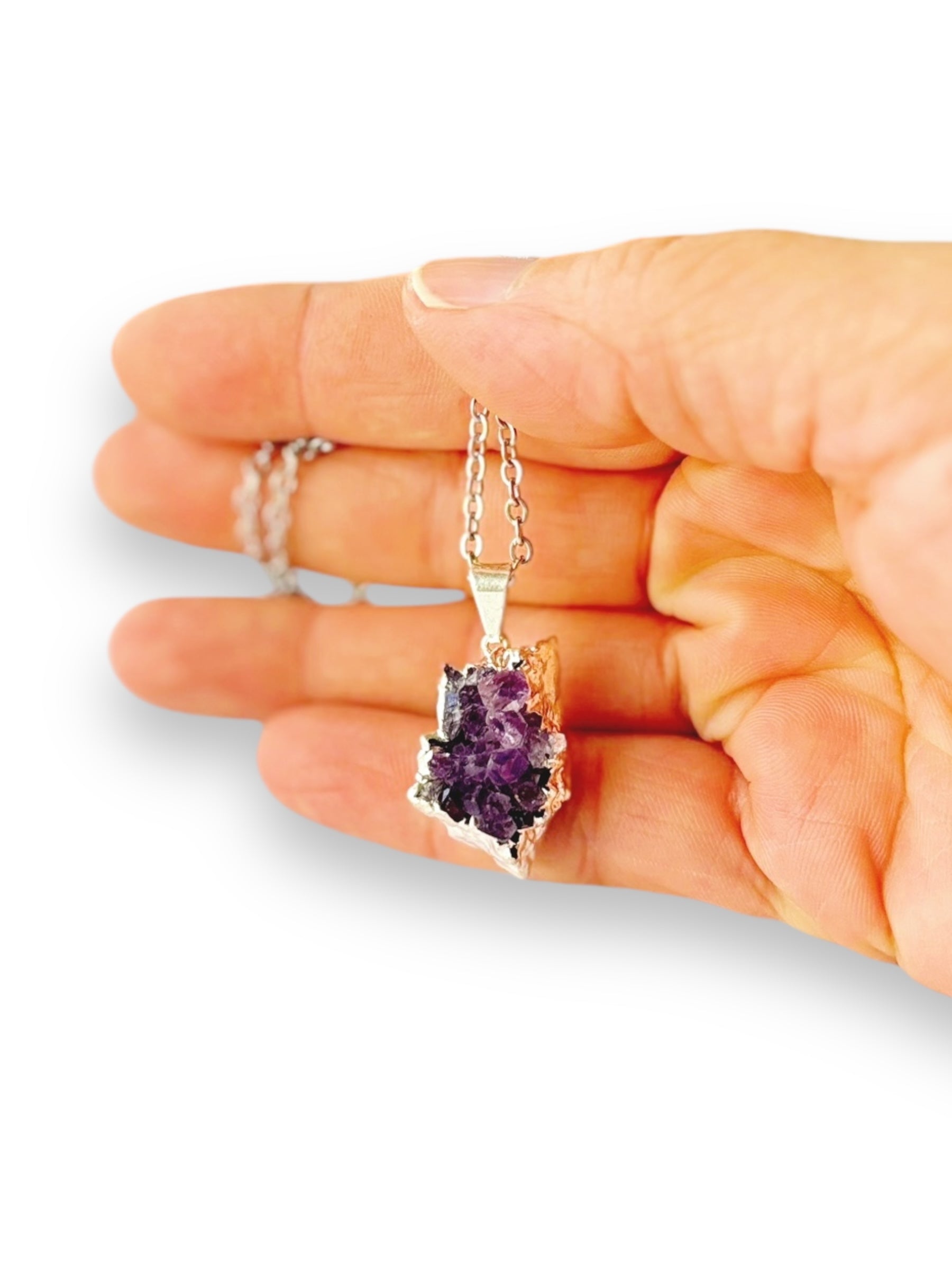 Close-up of Amethyst drusy pendant showing raw crystal texture and sparkle