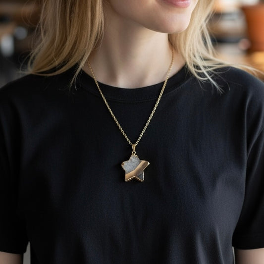 Modeled view of a gold plated amethyst star pendant necklace on a PVD gold plated stainless steel chain, shown in an AI generated lifestyle image.