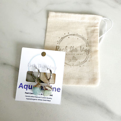 Aquamarine drop huggie earrings packaged on Rock This Way Crystal Shop jewelry card