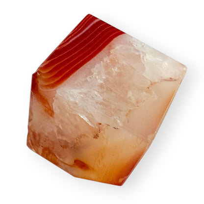 Polished Carnelian Agate freeform showing translucent agate layers and natural mineral formations.