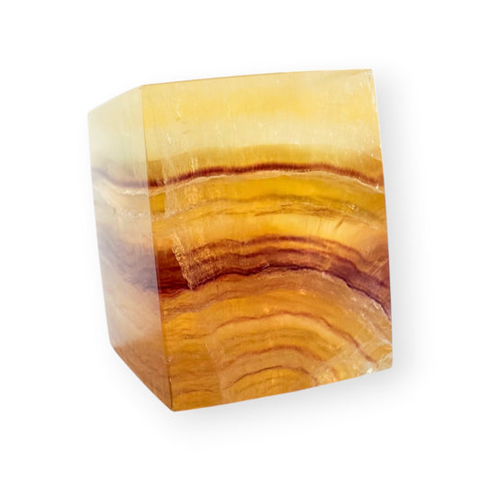 Banded Golden Fluorite freeform with layered honey, amber, cream, and caramel-colored natural banding.