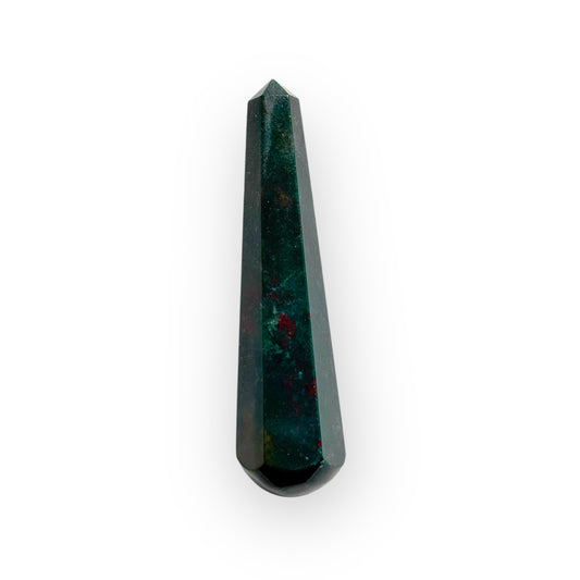 Close-up of polished Bloodstone wand with pointed tip and red flecks on dark green crystal surface.