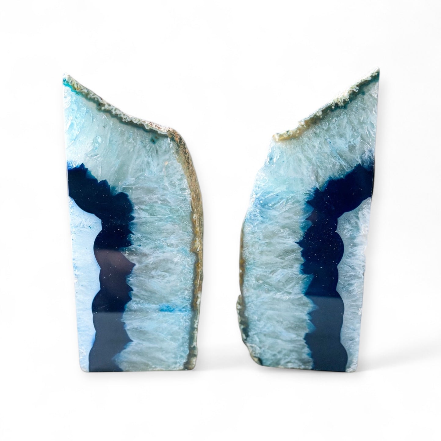 Side view of blue agate bookends showing layered crystal and natural stone.