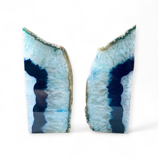 Side view of blue agate bookends showing layered crystal and natural stone.