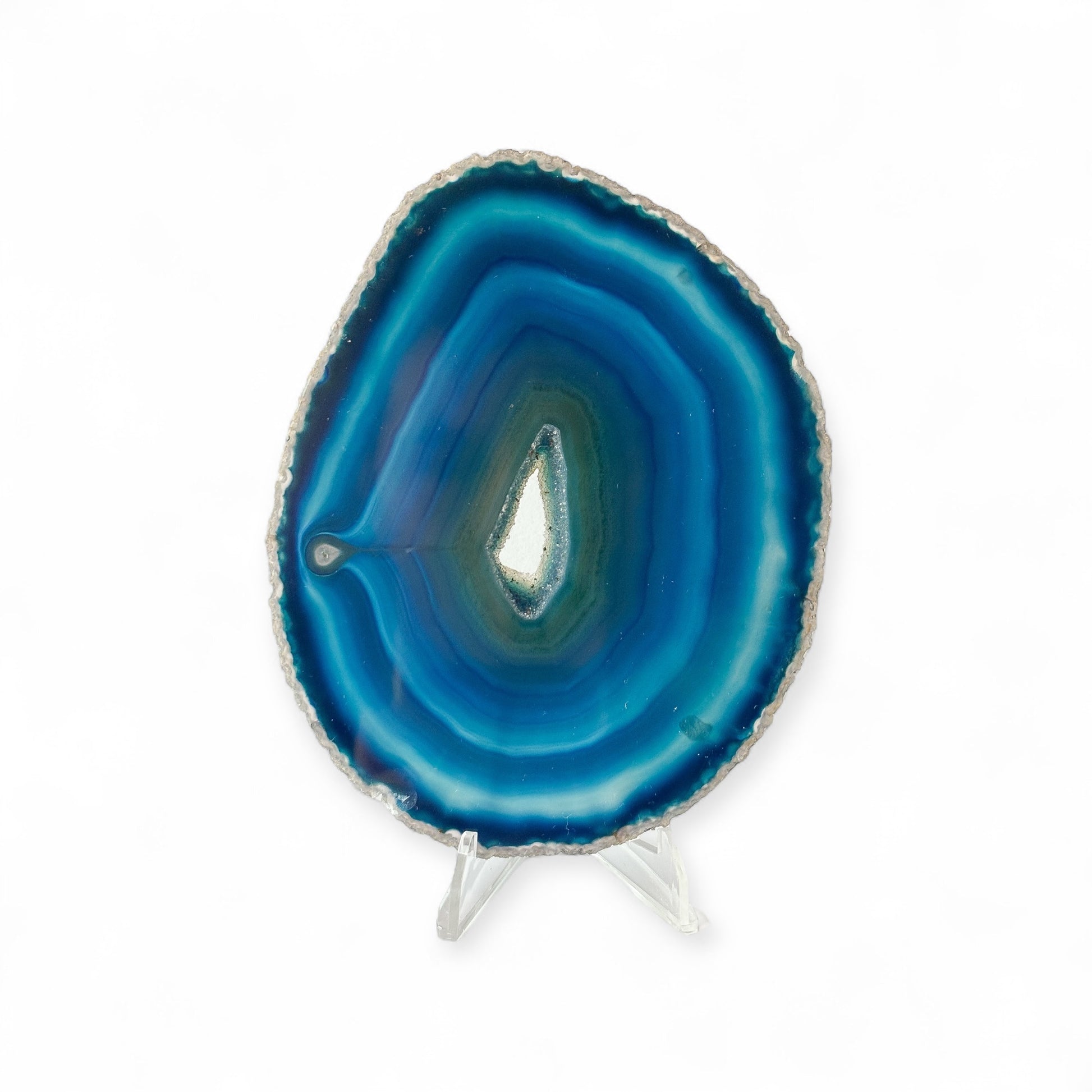 Front view of polished blue agate slice with sparkling drusy center