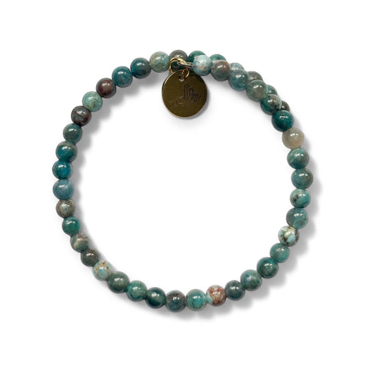 Blue Apatite Wrap Bracelet with deep blue and teal micro-faceted beads on white background